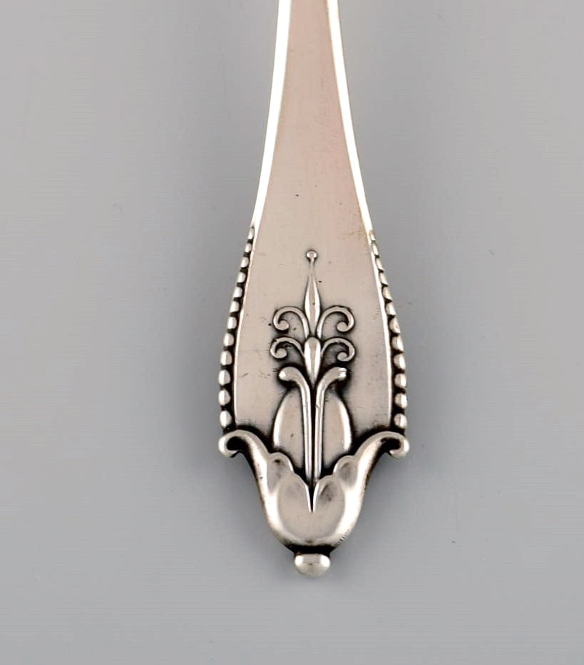 Four Georg Jensen Akkeleje dessert spoons in silver (830). Dated 1920. - 4