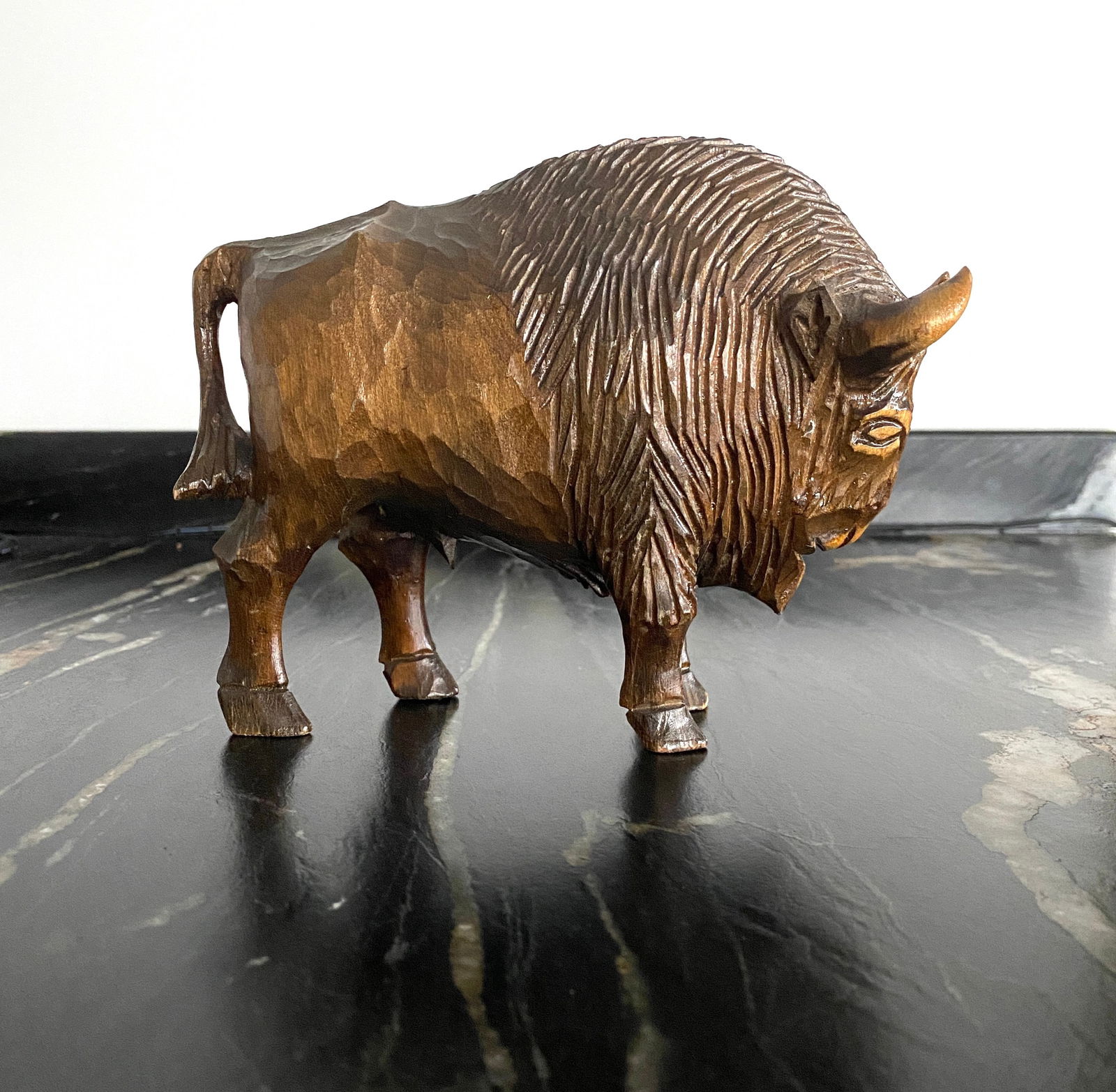 Amazing Vintage Wood Statue shaped like a Bison ramming a tree: Title: Amazing Vintage Wood Statue shaped like a Bison ramming a treeMaker:UnknownOrigin: UnknownDate/Period:UnknownMaterials:WoodSize:Size: 260.0 x 100.0 x 230.0 mm Size: 10.236 x 3.937 x 9.055