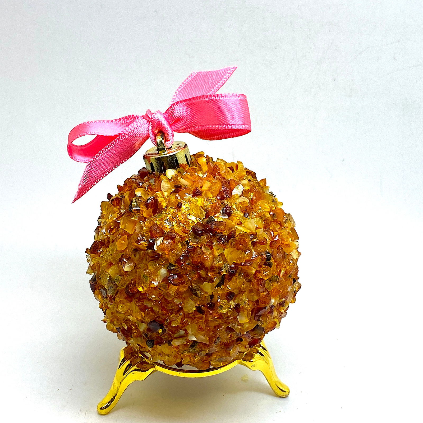 Natural Amber Christmas tree ball: Title: Natural Amber Christmas tree ball Maker:UnknownOrigin: UnknownDate/Period:UnknownMaterials:AmberSize:Size: 6.5 x 6.5 x 7 cmDescription:Size: 6.5 x 6.5 x 7 cm Reserve: $95.00 
