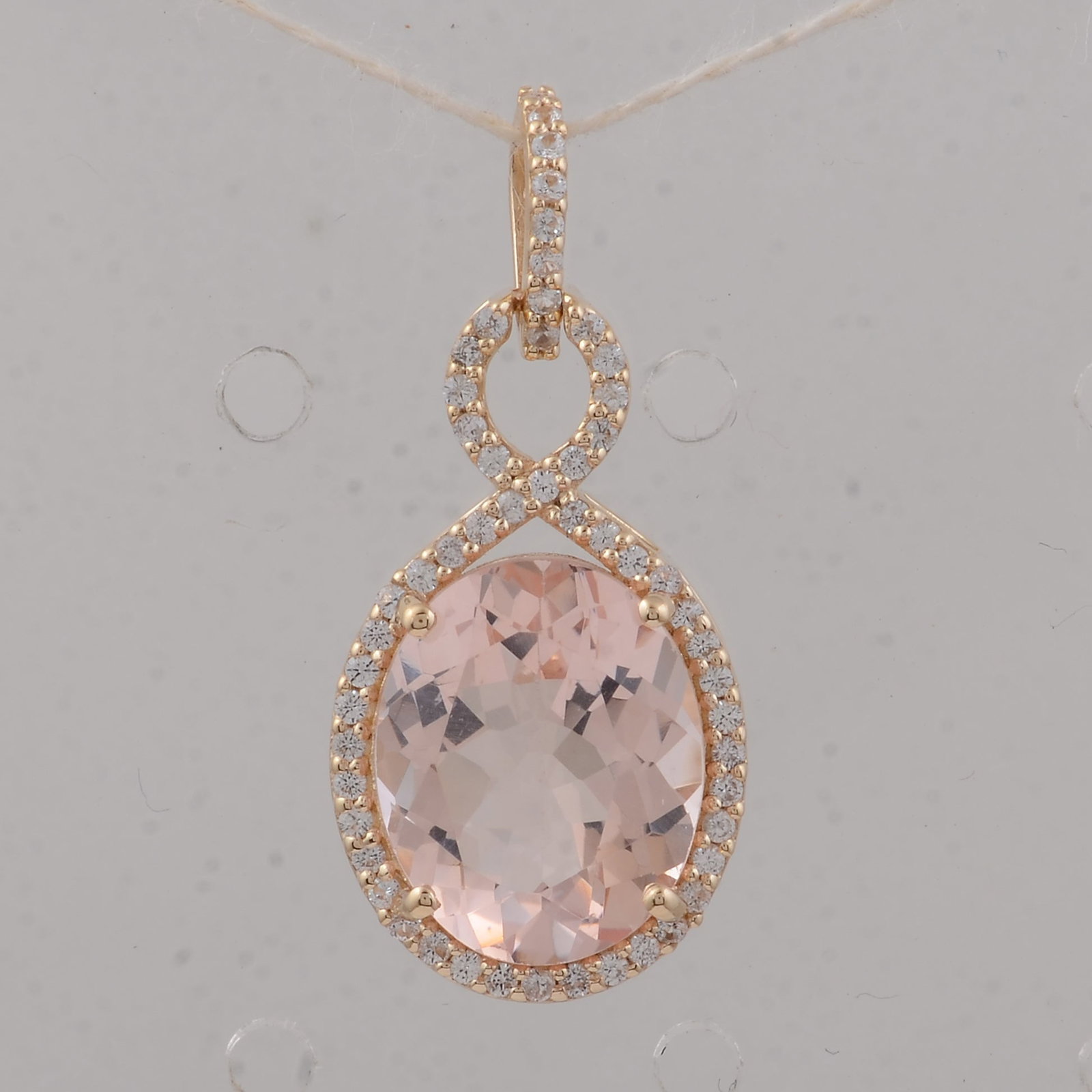 3.56 Ct Oval Morganite 9K Gold Pendant: 3.56 Total Carat Morganite 9K Gold Pendant Specifications - Total Weight 1.73 g - Center Gemstone Morganite - Gemstone Carat Weight 3.32 Carats - Gemstone Measurements 11X9X5.60 mm - Additional