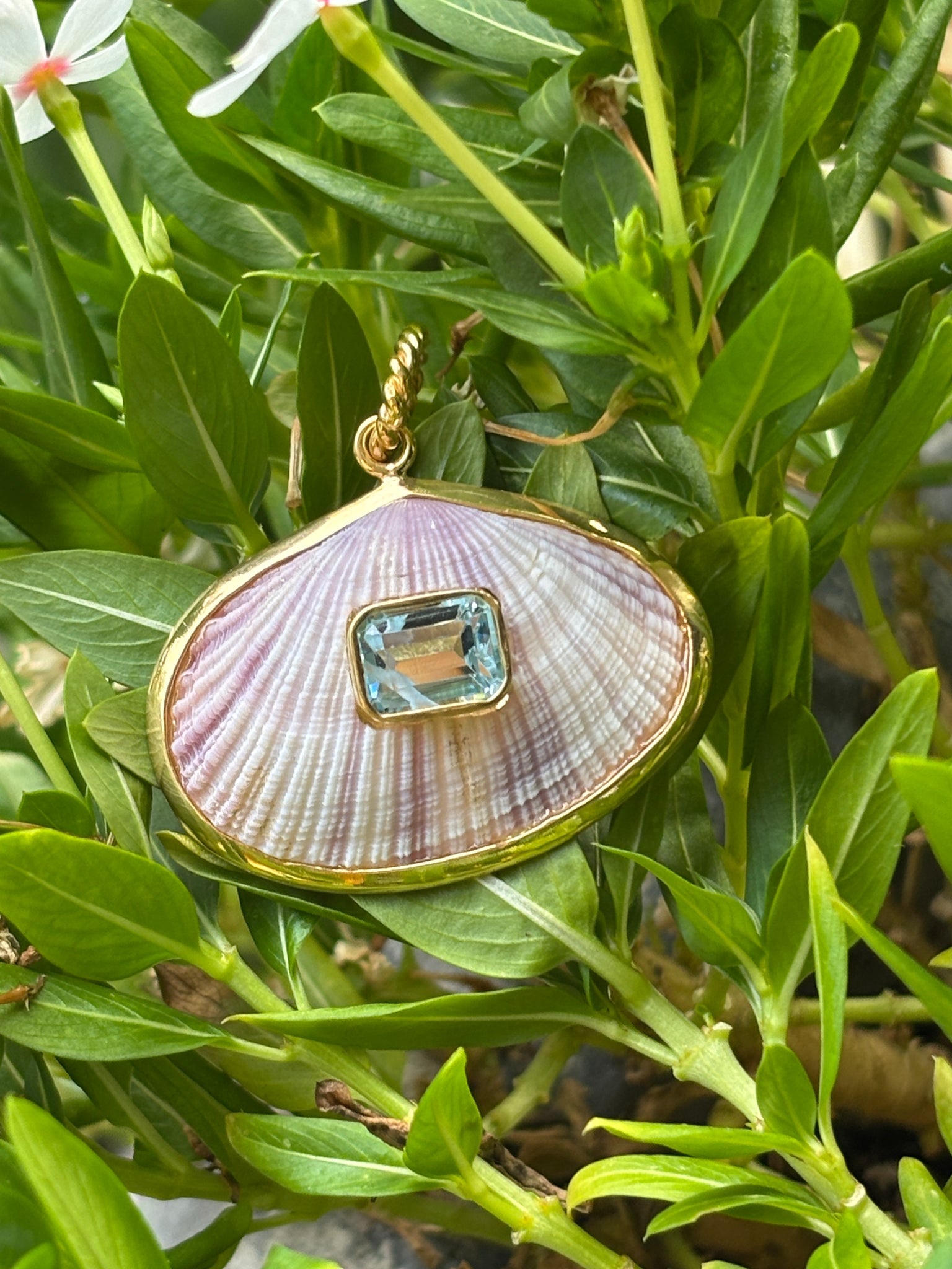 Cockle and Aquamarine Pendant: Title:Cockle and Aquamarine PendantDescription:Lavender Cockle shell sporting a watery Aquamarine set in the center. A little bigger than our charms, this pendant is Vermeil. Signed CSS - Vermeil