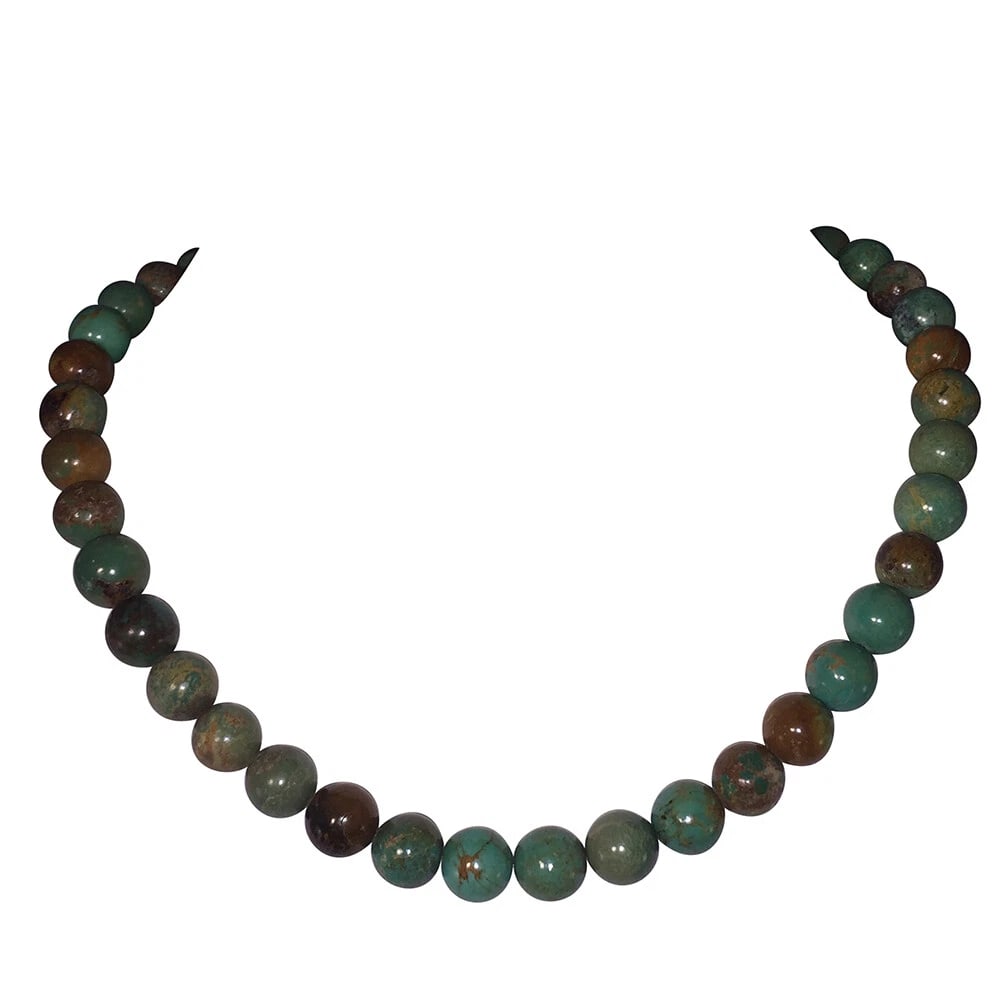Turquoise Round Bead Sterling Necklace: Title:Turquoise Round Bead Sterling NecklaceDescription:Natural turquoise round bead necklace with sterling silver hook and chain extender. Circa 1980s. Measures 18" long with 3" extender, beads