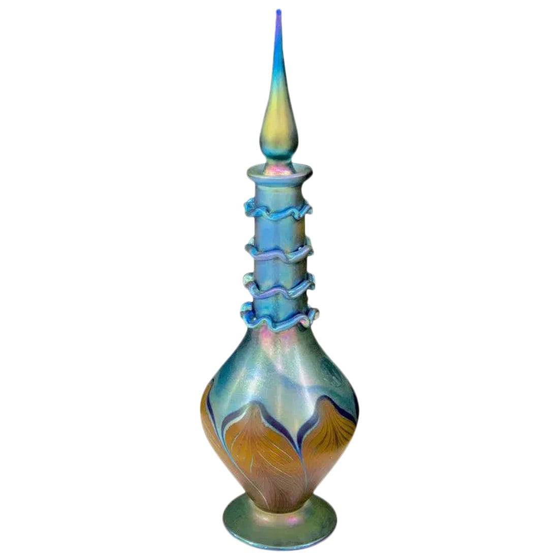 Late 20th Century Vandermark Art Glass Decanter, in the Style of Louis Comfort Tiffany: Vandermark Art Glass Pulled Feather Decanter, in the style of Louis Comfort Tiffany. Signed in script. Measures: Stands 16" high, 5" diameter and 3" base. Condition: Alterations: Unknown