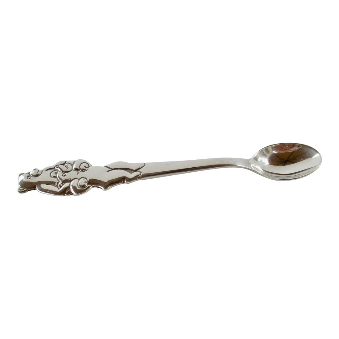 Tiffany & Co. Teddy Bears Baby Spoon: Tiffany & Co. Teddy Bear pattern sterling silver children's spoon. Teddys piggyback on the way to the table. Children's eating spoon. Marked Tiffany and serial # 2253832206. The measurements are