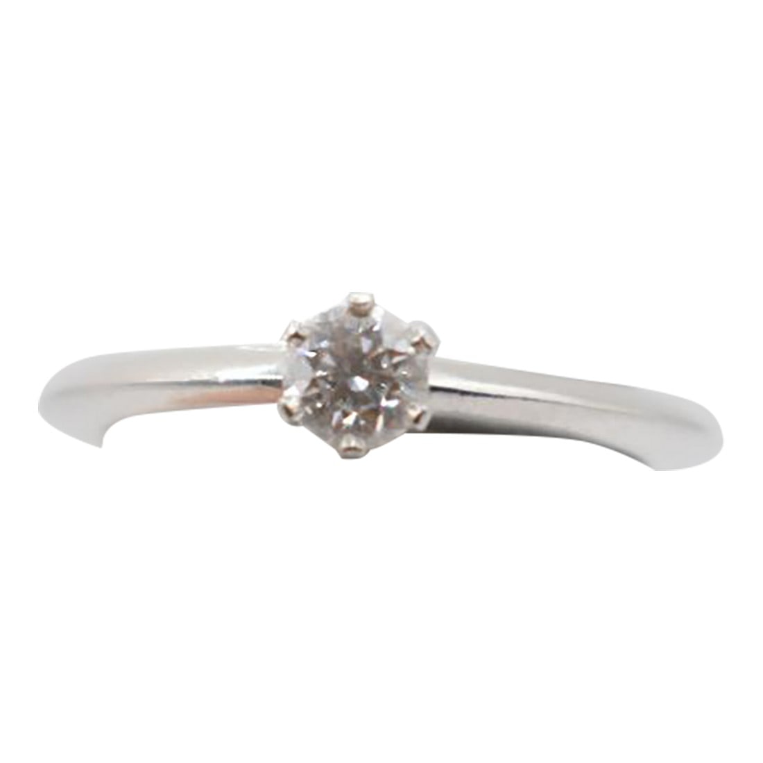 Mid 20th Century Tiffany & Co Diamond Solitaire Ring, Size 5.25: This is a Tiffany & Company platinum and diamond solitaire ring. It features a 0.24 ct round cut diamond with color E and clarity VS2. It is marked Tiffany & Co. PT 950, T97430, .24ct. This ring