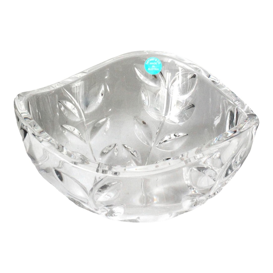 Tiffany & Co Crystal Bowl: This elegant crystal bowl by Tiffany & Co., made in Austria, features the delicate Floral Vine pattern carved into the clear crystal. Measuring 6.25" in diameter, it makes a stunning decorative piece