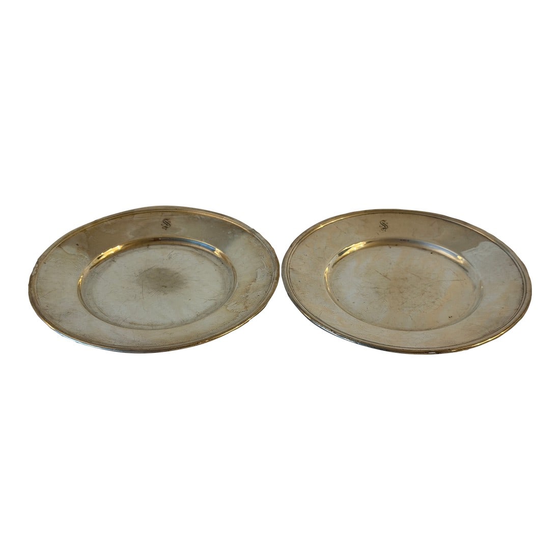 Vintage Pair of Tiffany & Co. Sterling Silver Small Plates: Vintage pair of small sterling silver plates by Tiffany & Co., featuring a classic, understated design. Well suited for display, light serving, or as part of a refined silver collection. Dimensions (e