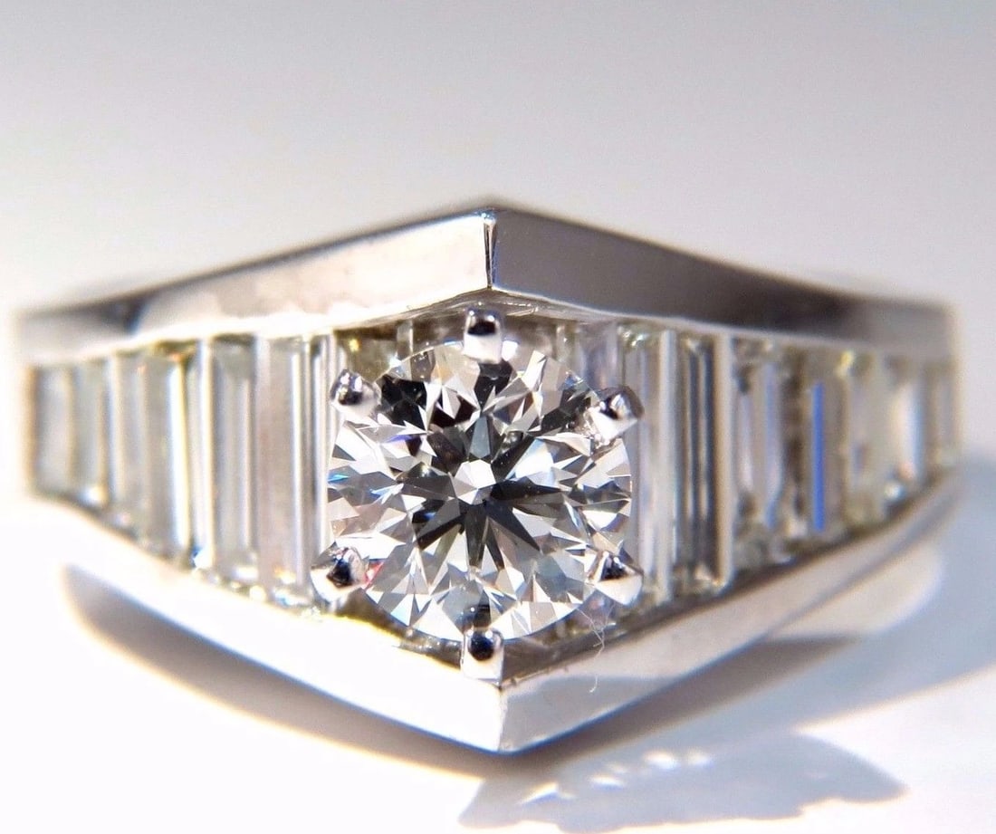 GIA Certified .73ct & 1.50ct round diamond baguette ring excellent cut f/vvs1+: Title: GIA Certified .73ct & 1.50ct round diamond baguette ring excellent cut f/vvs1+ Description: MAGNIFICENT JEWELS GIA .73ct. Round, brilliant diamond ring Report: 2165625821 (please see certificat