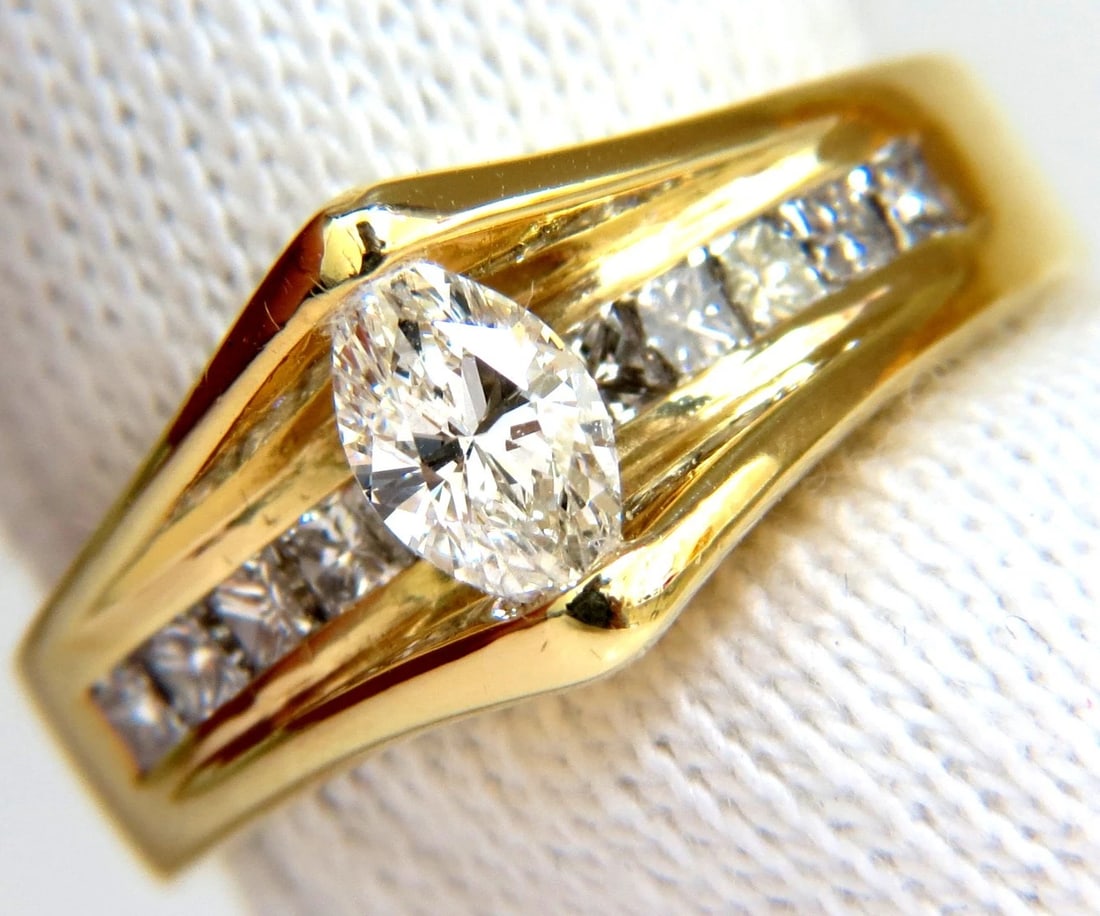 1.12CT 18KT 1.12CT DIAMONDS TENSION TOP CLASS MOD DECO HANDMADE RING+: Title: 1.12CT 18KT 1.12CT DIAMONDS TENSION TOP CLASS MOD DECO HANDMADE RING+ Description: ONLY MAGNIFICENT JEWELS Marquise Tension + Princess Cuts Deco diamond ring. Center diamond: .52ct. Marquise di