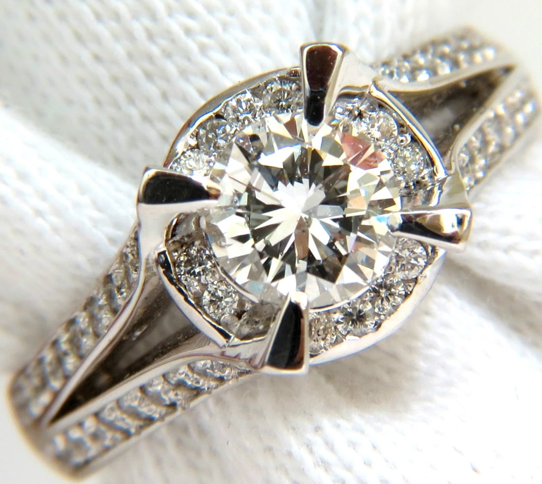 1.61CT ROUND BRILLIANT DIAMOND RAISED CROWN RING+: Title: 1.61CT ROUND BRILLIANT DIAMOND RAISED CROWN RING+ Description: .85ct. Round brilliant diamond ring. Round, full cut H-color, Si-2 clarity. Side diamonds: .76ct. Rounds, full cut G-color Vs-2 cl