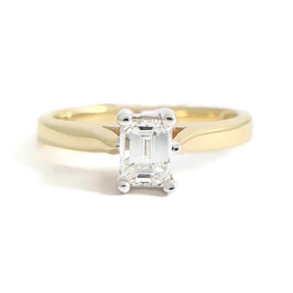 Emerald Cut Solitaire Diamond Engagement Ring 14K Yellow Gold .45 CT, 3.39 Grams: Emerald Cut Solitaire Diamond Engagement Ring 14K Yellow Gold .45 CT, 3.39 Grams This lovely diamond engagement ring is sure to make her smile! Diamonds: 1 emerald cut, .45 ct, G, VS2-SI1 Metal: 14K