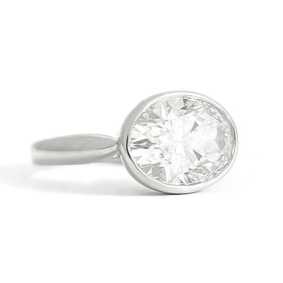 Oval Lab-Created Diamond Bezel Solitaire Engagement Ring 14K White Gold, 3.56 CT: Oval Lab-Created Diamond Bezel Solitaire Engagement Ring 14K White Gold, 3.56 CT This is a beautiful diamond engagement ring! Diamonds: 1 lab-created oval 3.56 ct, E, VVS2 Certified: IGI Metal: 14K wh