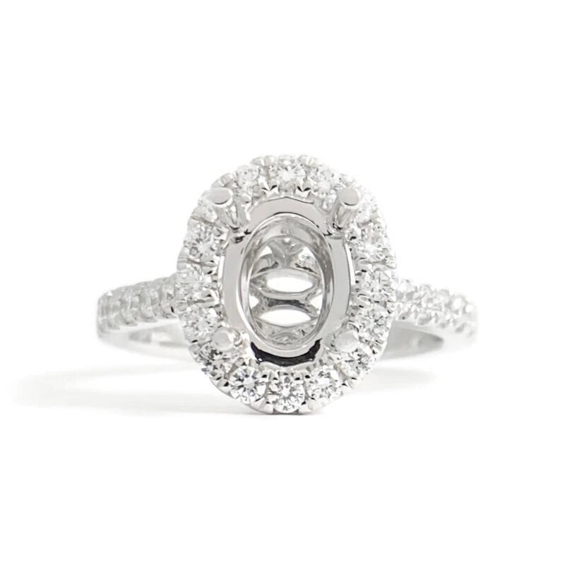 Oval Diamond Halo Engagement Ring Setting Mounting 18K White Gold .51 CTW: Oval Diamond Halo Engagement Ring Setting Mounting 18K White Gold .51 CTW This is a beautiful diamond engagement ring mounting ready to house a diamond or gemstone of your choice. Don't hesitate to as