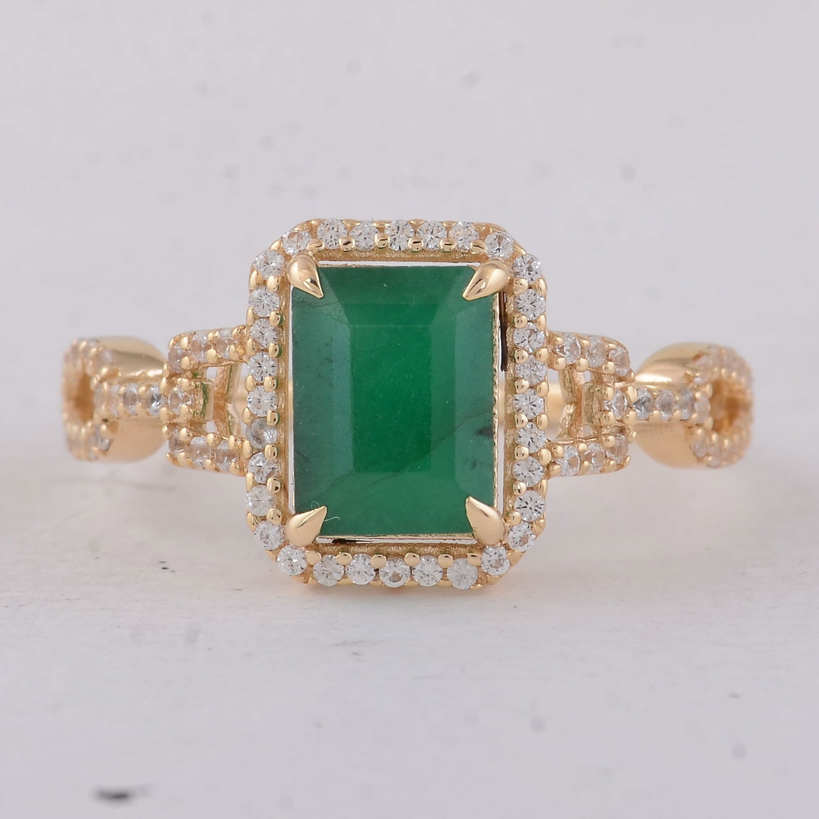 1.88 Ct Octagon Emerald 9K Gold Ring: 1.88 Total Carat Emerald 9K Gold Ring Specifications - Total Weight 2.24 g - Center Gemstone Emerald - Gemstone Carat Weight 1.53 Carats - Gemstone Measurements 8X6X4.20 mm - Additional Gemstones Whit