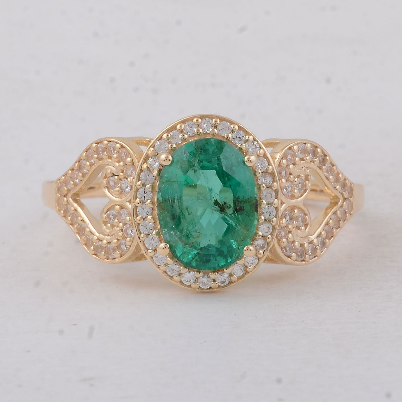 2.02 Ct Oval Emerald 9K Gold Ring: 2.02 Total Carat Emerald 9K Gold Ring Specifications - Total Weight 2.55 g - Center Gemstone Emerald - Gemstone Carat Weight 1.69 Carats - Gemstone Measurements 8.20X6.30X5 mm - Additional Gemstones W