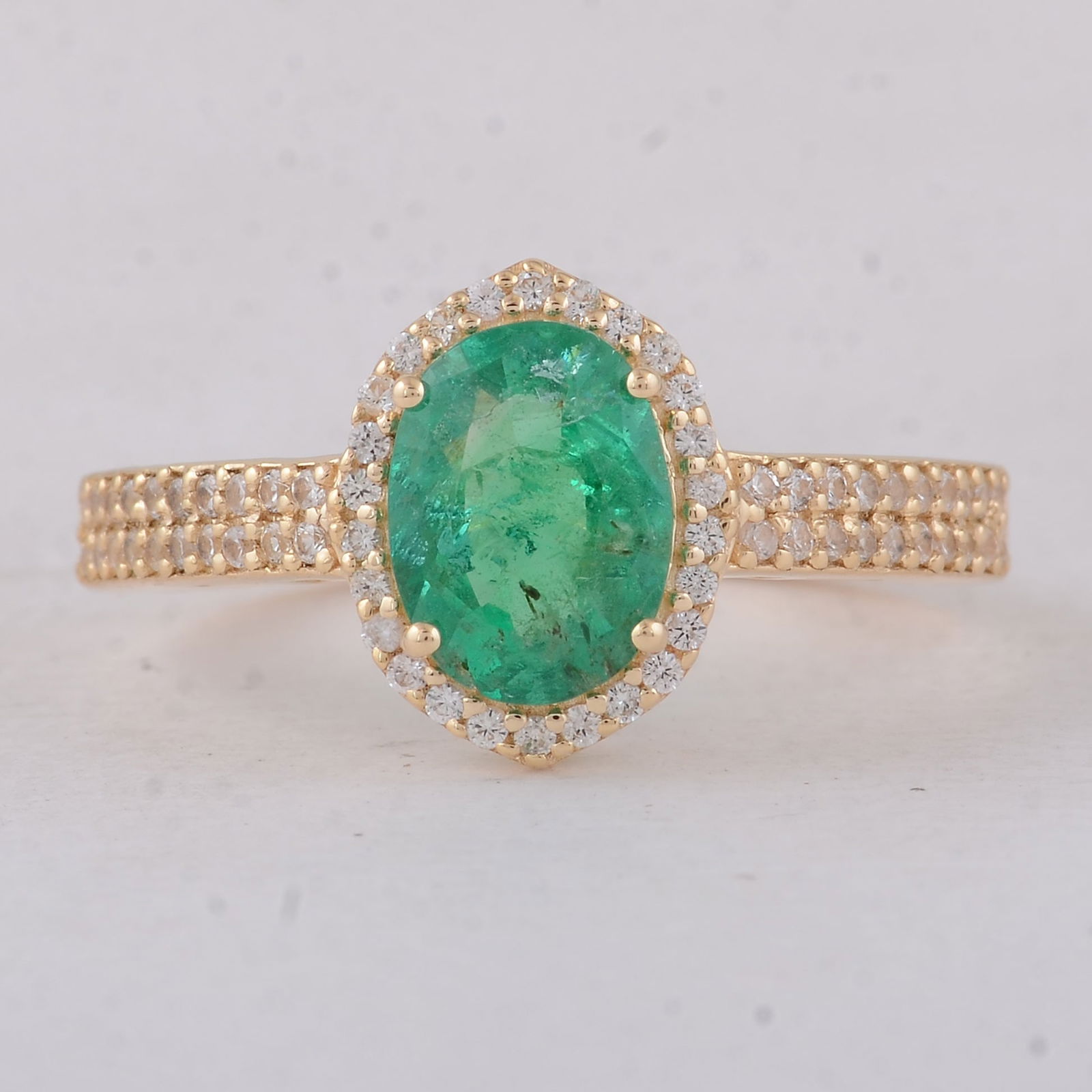 1.50 Ct Oval Emerald 9K Gold Ring: 1.50 Total Carat Emerald 9K Gold Ring Specifications - Total Weight 2.18 g - Center Gemstone Emerald - Gemstone Carat Weight 1.21 Carats - Gemstone Measurements 8.30X6.20X3.90 mm - Additional