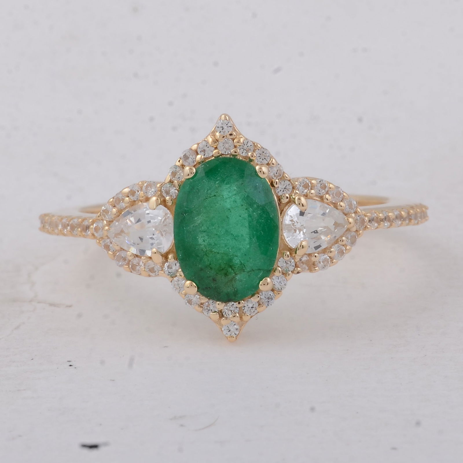 1.58 Ct Oval Emerald 9K Gold Ring: 1.58 Total Carat Emerald 9K Gold Ring Specifications - Total Weight 2.06 g - Center Gemstone Emerald - Gemstone Carat Weight 1.03 Carats - Gemstone Measurements 7.90X5.70X3.20 mm - Additional Gemstone