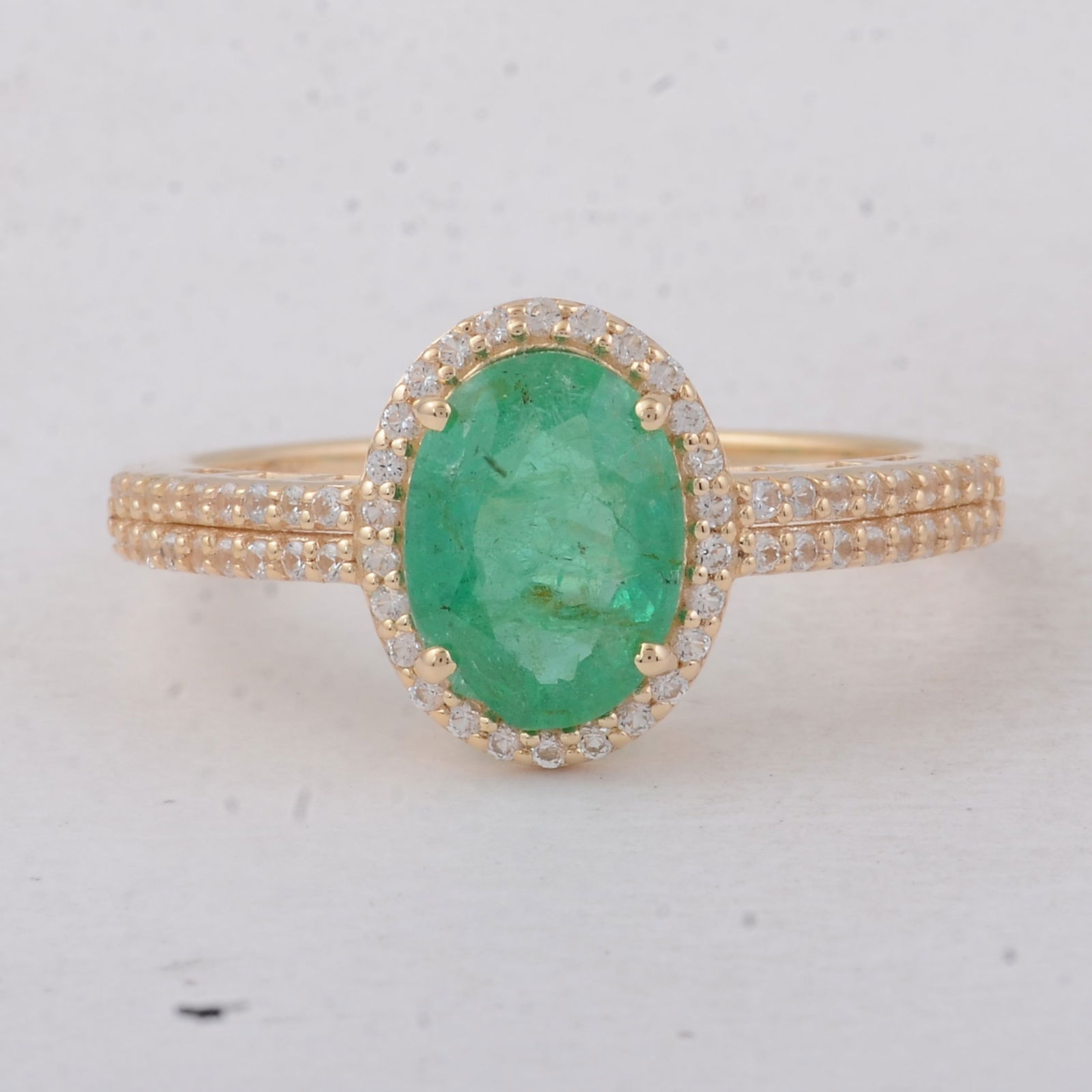 1.54 Ct Oval Emerald 9K Gold Ring: 1.54 Total Carat Emerald 9K Gold Ring Specifications - Total Weight 2.25 g - Center Gemstone Emerald - Gemstone Carat Weight 1.27 Carats - Gemstone Measurements 8.70X6.50X3.80 mm - Additional Gemstone