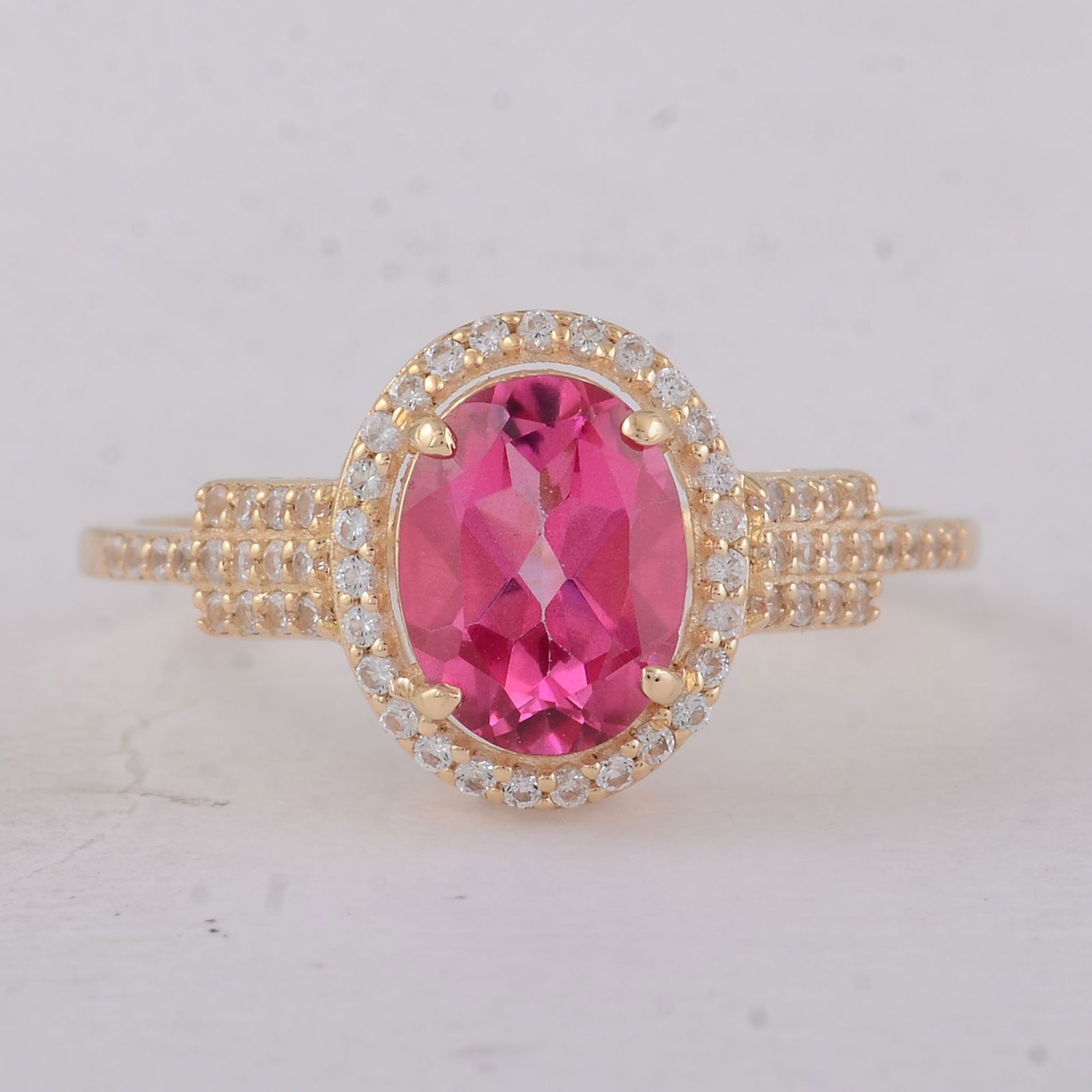 1.86 Ct Oval Pink Topaz 9K Gold Ring: 1.86 Total Carat Pink Topaz 9K Gold Ring Specifications - Total Weight 2 g - Center Gemstone Pink Topaz - Gemstone Carat Weight 1.59 Carats - Gemstone Measurements 8X6 mm - Additional Gemstones White