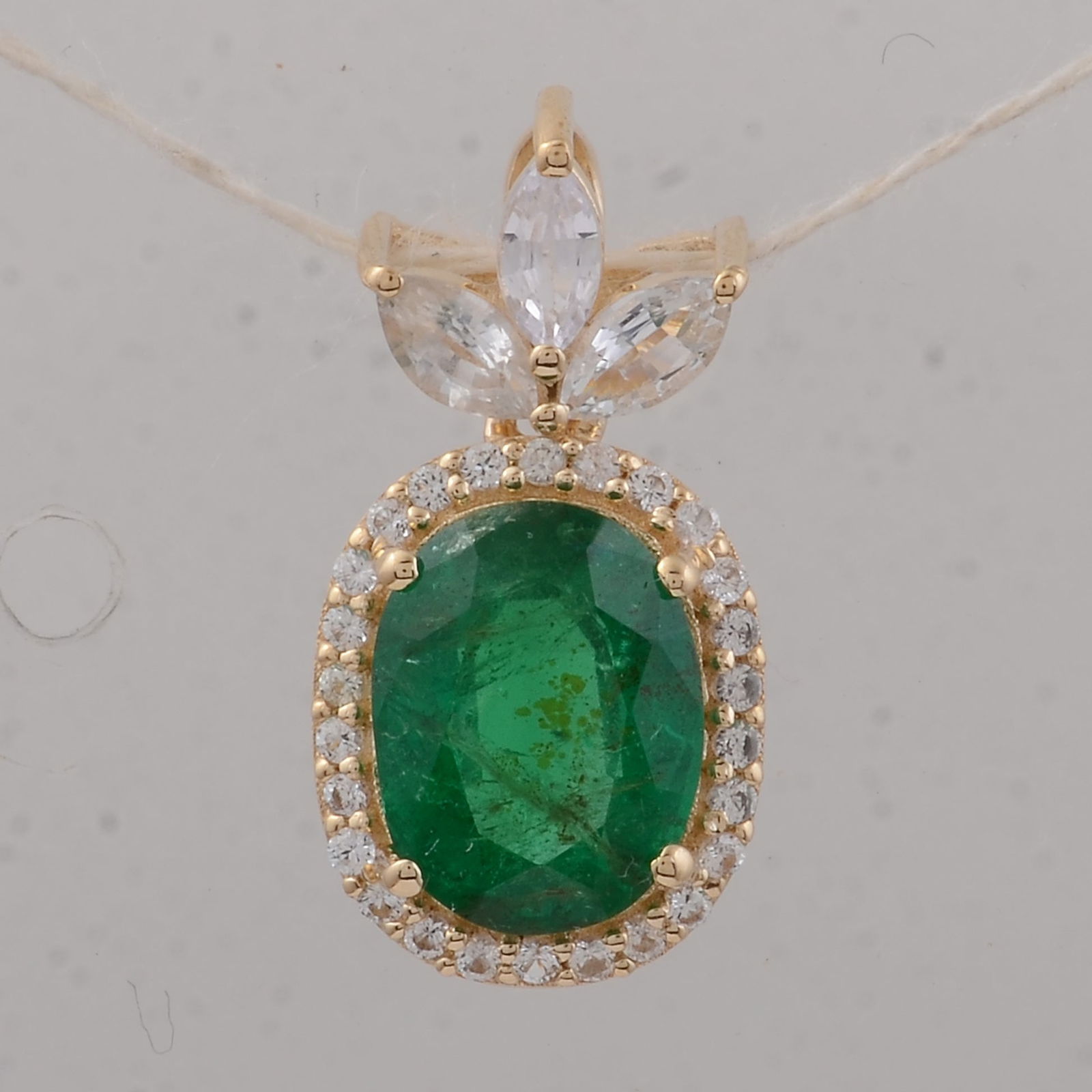 1.95 Ct Oval Emerald 9K Gold Pendant: 1.95 Total Carat Emerald 9K Gold Pendant Specifications - Total Weight 1.17 g - Center Gemstone Emerald - Gemstone Carat Weight 1.52 Carats - Gemstone Measurements 8.20X6.30X4.10 mm - Additional