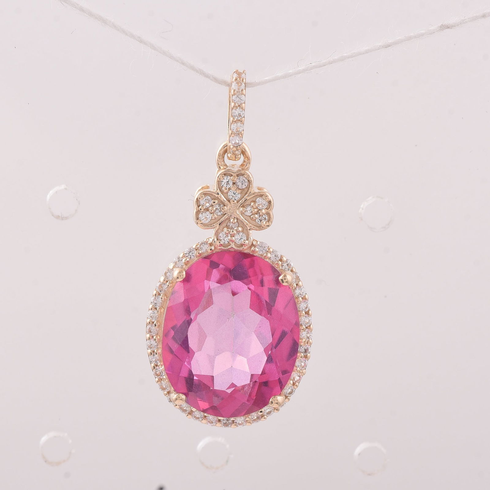 6.52 Ct Oval Pink Topaz 9K Gold Pendant: 6.52 Total Carat Pink Topaz 9K Gold Pendant Specifications - Total Weight 2.388 g - Center Gemstone Pink Topaz - Gemstone Carat Weight 6.3 Carats - Gemstone Measurements 12X10 mm - Additional