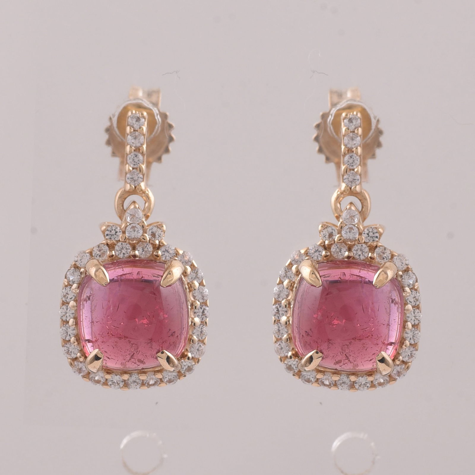 2.60 Ct Cushion Tourmaline 9K Gold Earrings: 2.60 Total Carat Tourmaline 9K Gold Earrings Specifications - Total Weight 1.865 g - Center Gemstone Tourmaline - Gemstone Carat Weight 2.33 Carats - Gemstone Measurements 6X6 mm - Additional