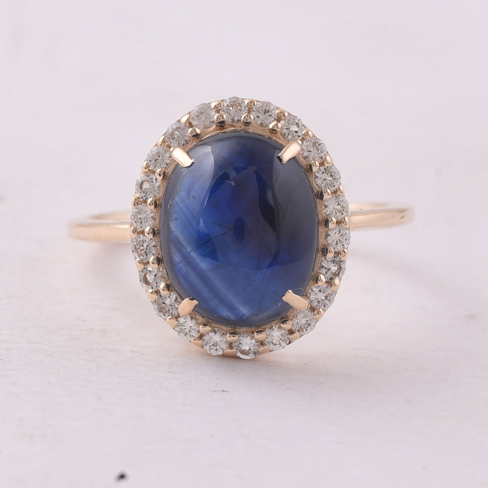 5.30 Ct Oval Sapphire 9K Gold Ring: 5.30 Total Carat Sapphire 9K Gold Ring Specifications - Total Weight 2.723 g - Center Gemstone Sapphire - Gemstone Carat Weight 4.9 Carats - Gemstone Measurements 11X8.90X4.60 mm - Additional Gemstone