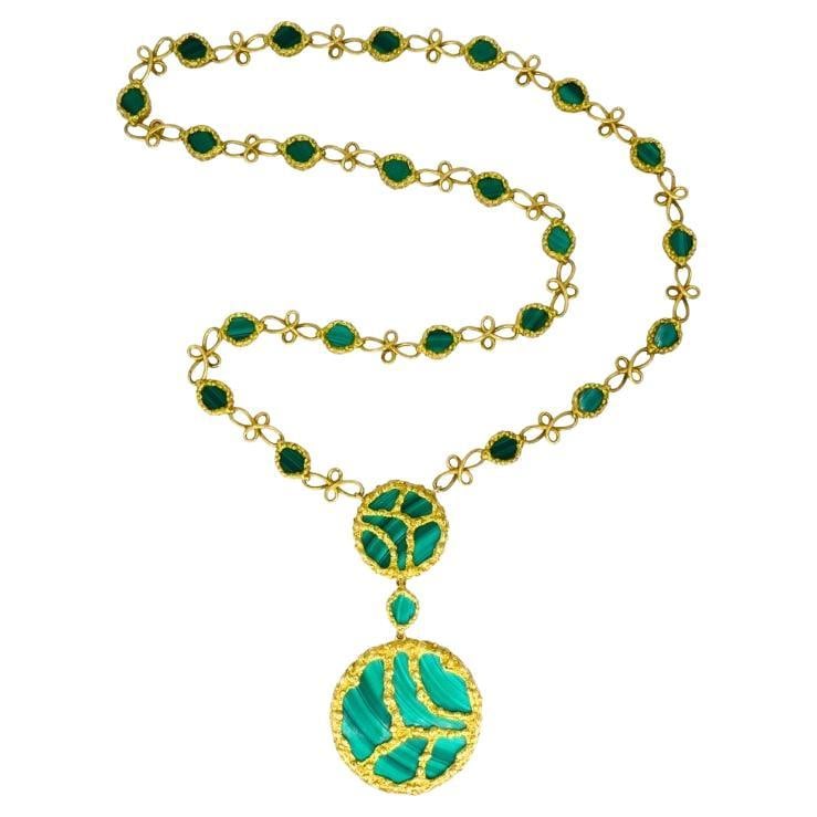 1980s Mauboussin Paris 18k Gold Malachite Pendant Necklace: About the Item A dramatic Mauboussin 18k gold and malachite pendant necklace, circa 1980s. Designed in rich yellow gold, the necklace features two large circular pendants set with inlaid malachite pan