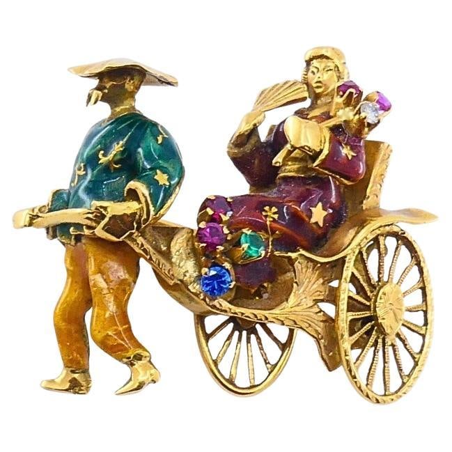 Vintage 18k Gold Enamel Riksha Brooch Pin Gemstone Accents: About the Item CIRCA: 1930s MATERIALS: 18k Gold, Enamel WEIGHT: 12.5 Grams MEASUREMENTS: 1 1/8" x 1 1/4" HALLMARKS: 750 ITEM DETAILS: Exceptional vintage brooch crafted in solid 18k gold and marked