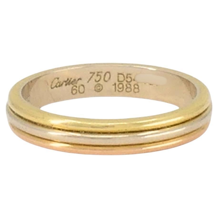 Cartier Trinity Band 18k Gold Men Ring Size 9.5 Original Box: About the Item The Cartier Trinity ring is one of the brand’s most recognized designs, known for its simplicity and meaning. This Cartier wedding band features three connected rings made of 18k