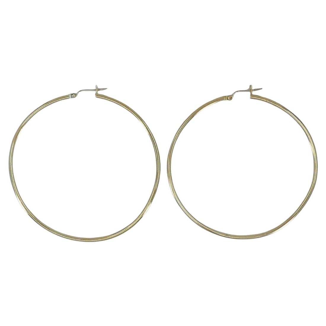 14k Gold Large Hoop Earrings: About the Item These large 14k yellow gold hoop earrings feature a timeless round silhouette with a clean, minimalist finish. Measuring 2 1/4 inches in diameter, they offer a bold yet lightweight