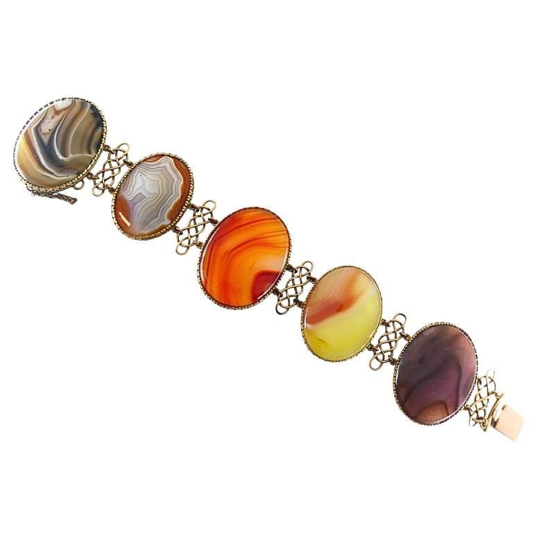Antique A & J. Smith Aberdeen Scottish Agate 9k Gold Bracelet: About the Item This antique bracelet by A & J. Smith of Aberdeen showcases the timeless elegance of late Victorian Scottish jewelry. Crafted in 9k gold, it features five large, oval, multi-colored