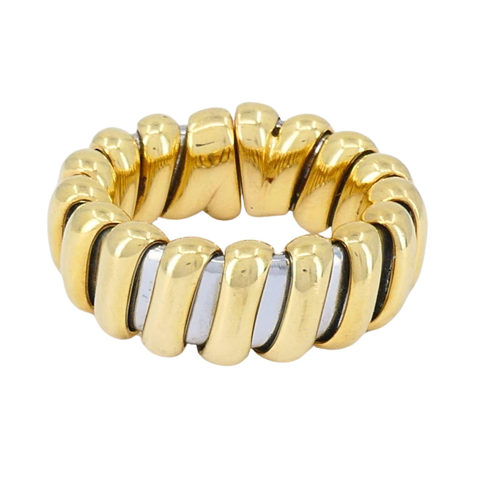 Vintage Bvlgari 18k Gold Stainless Steel Ring: About the Item This vintage Bvlgari ring is a striking example of the house’s sculptural Italian design from the 1980s. Crafted in 18K yellow and white gold, the ring features a fluid, ribbed