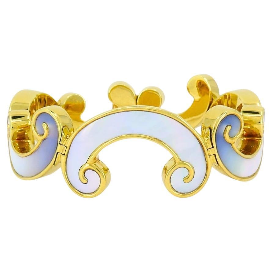 Vintage Angela Cummings 18K Gold and Mother of Pearl Bracelet: About the Item This vintage Angela Cummings bracelet highlights the designer’s signature style of combining organic forms with luxurious materials. Crafted in 18k yellow gold, the bracelet