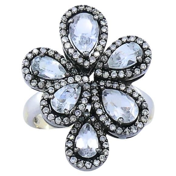 14k Gold Diamond Floral Cocktail Ring: About the Item This striking 14k gold cocktail ring is crafted in a bold floral design, centering on six pear-shaped rose-cut diamonds, each arranged in a radiant flower motif. Surrounding each