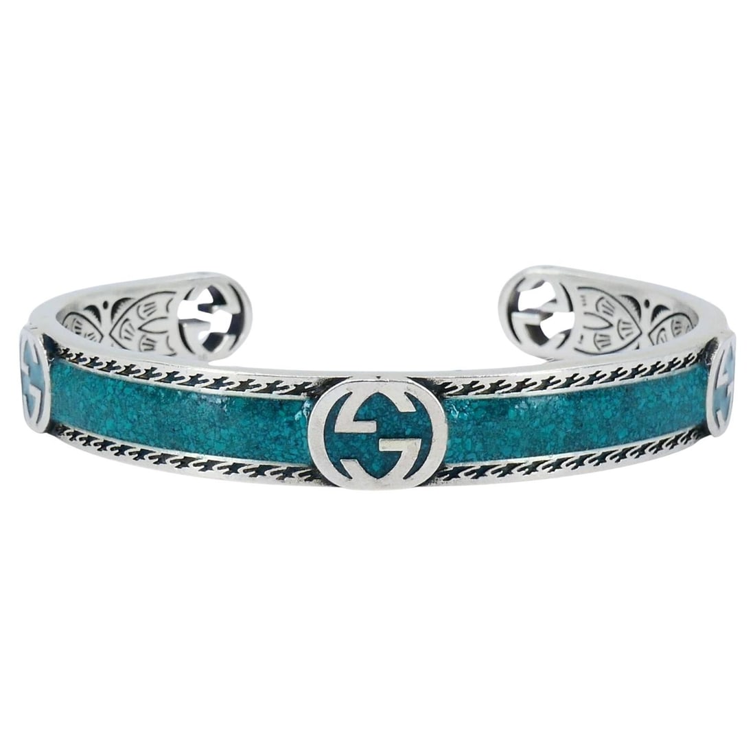 Gucci Sterling Silver Enamel Interlocking G Cuff Bracelet: About the Item This Gucci sterling silver enamel cuff bracelet highlights the brand’s signature craftsmanship and bold design. The bracelet is crafted in Ag 925 sterling silver and enamel,