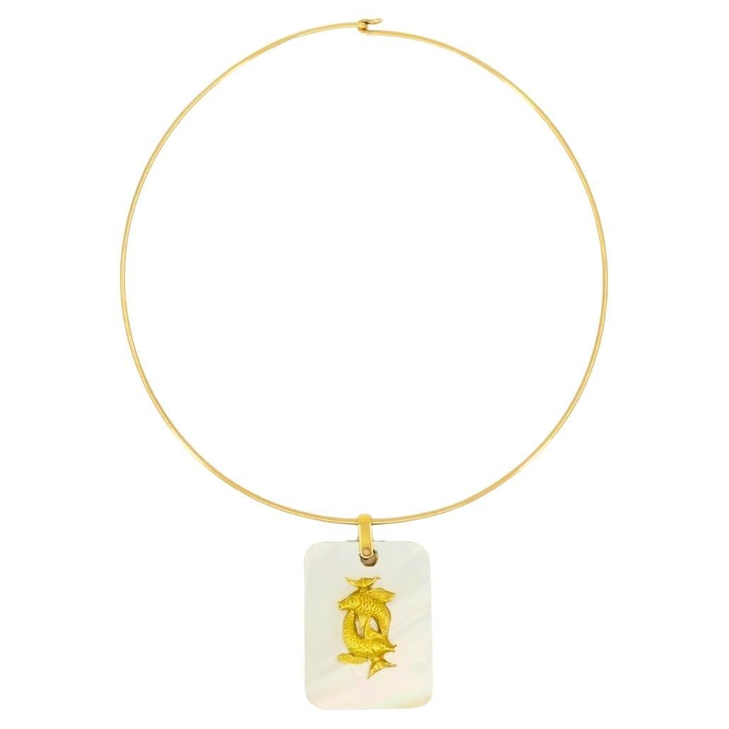 Vintage Pisces Pendant 18k Gold MOP 14k Gold Collar Necklace: About the Item This vintage necklace is composed of two parts: a Pisces pendant and a wire collar necklace. The pendant features a rectangular piece of luminous mother of pearl with a raised 18k gold