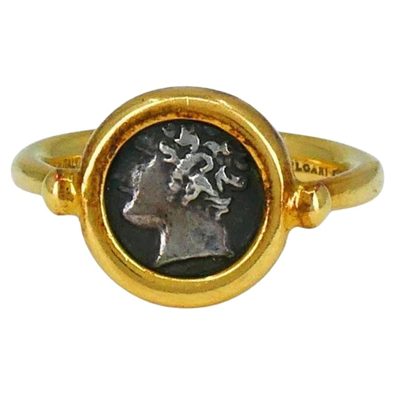 Bvlgari 18k Gold Monete Ancient Coin Ring: About the Item This authentic circa 1980s Bvlgari 18k gold Monete ring features an ancient Greek coin from Gallia Massalia (385–220 B.C.) set in a bold yellow gold bezel. The coin face, measurin