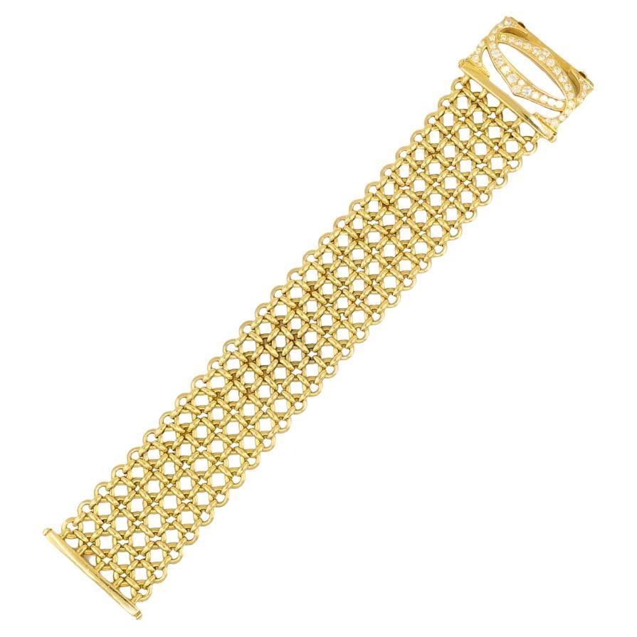 Cartier Penelope Bracelet Double C 18k Gold Diamond Link Bracelet: About the Item This vintage Cartier Penelope bracelet is crafted in 18k gold and designed with five rows of interlinked openwork circles. The repeating pattern creates a flexible structure that moves