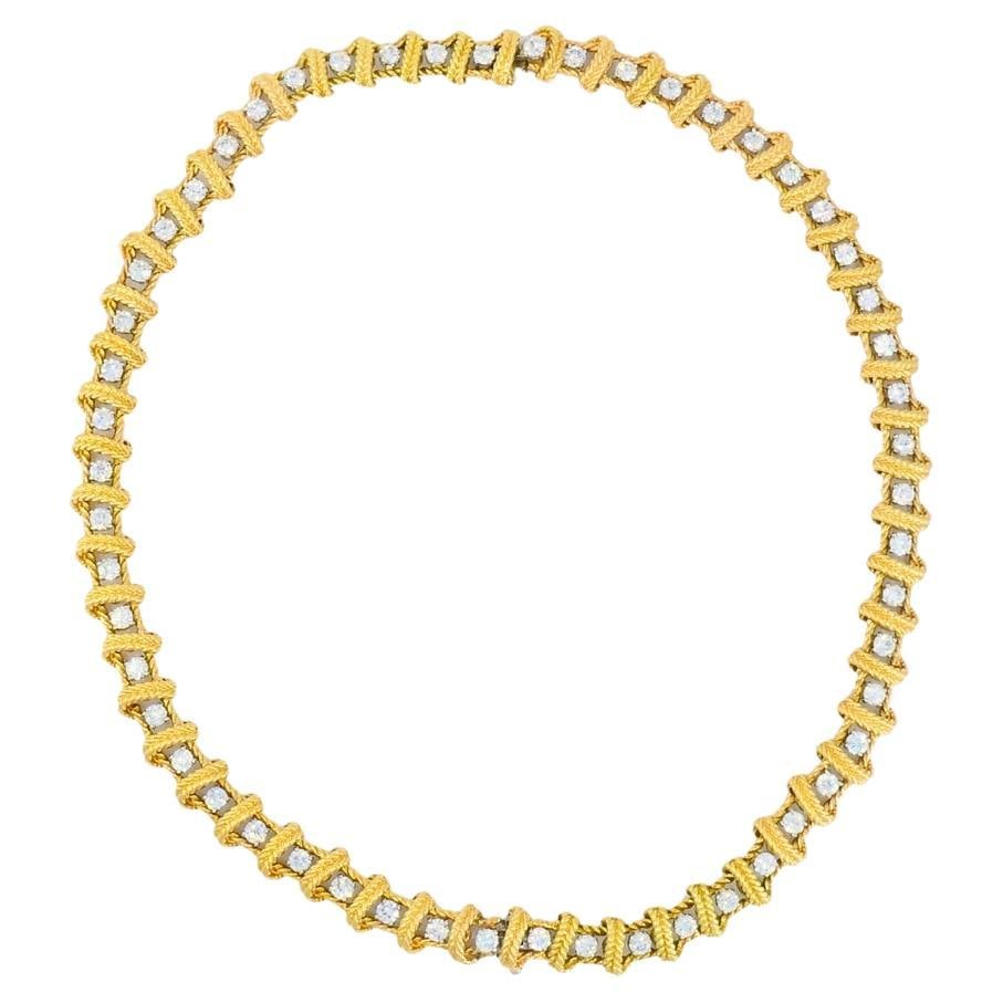 Ruser Diamond Necklace Two Bracelets Set Vintage Jewelry: About the Item This vintage Ruser diamond necklace is crafted from 18k yellow gold and set with round diamonds in a repeating geometric pattern. Each diamond is framed by a textured gold border,