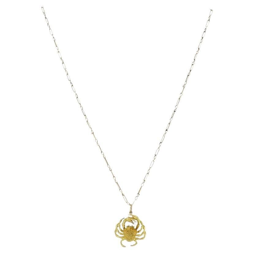 George Lederman 18k Gold Diamond Cancer Crab Pendant Necklace: About the Item This late 20th century necklace by George Lederman of New York features a sculptural crab pendant finely crafted in 18k yellow gold. The crab holds a single round brilliant diamond in