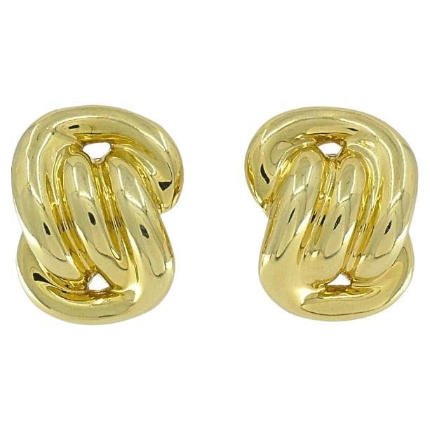 Vintage 14k Gold Earrings Swirl Design: About the Item A pair of vintage 14k gold earrings in a swirl design. High-polished finish makes them smooth and rounded, and generous volume gives them presence. Designed with an abstract swirl