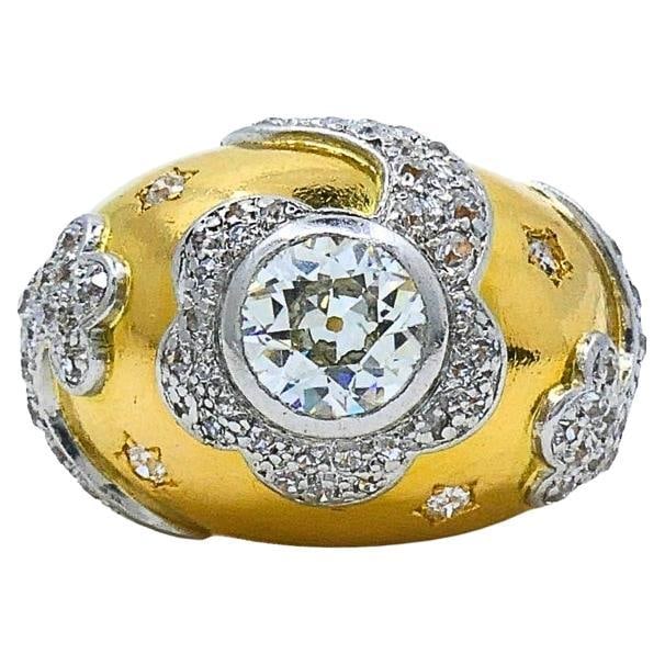 Vintage 18k Gold Diamond Floral Dome Ring: About the Item Make a bold statement with this exquisite 18K gold dome ring, featuring a floral motif. The ring is crafted in yellow gold and adorned with a central brilliant-cut diamond, beautifully