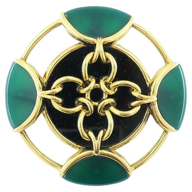 Vintage Tiffany & Co. Brooch Chrysoprase 18k Gold Onyx: About the Item DESIGNER: Tiffany & Co. CIRCA: 1980’s MATERIALS: 18k Yellow Gold GEMSTONE: Onyx, Chrysoprase WEIGHT: 42.1 Grams MEASUREMENTS: Diameter - 2" HALLMARKS: Tiffany & Co. , 18K ITEM DET