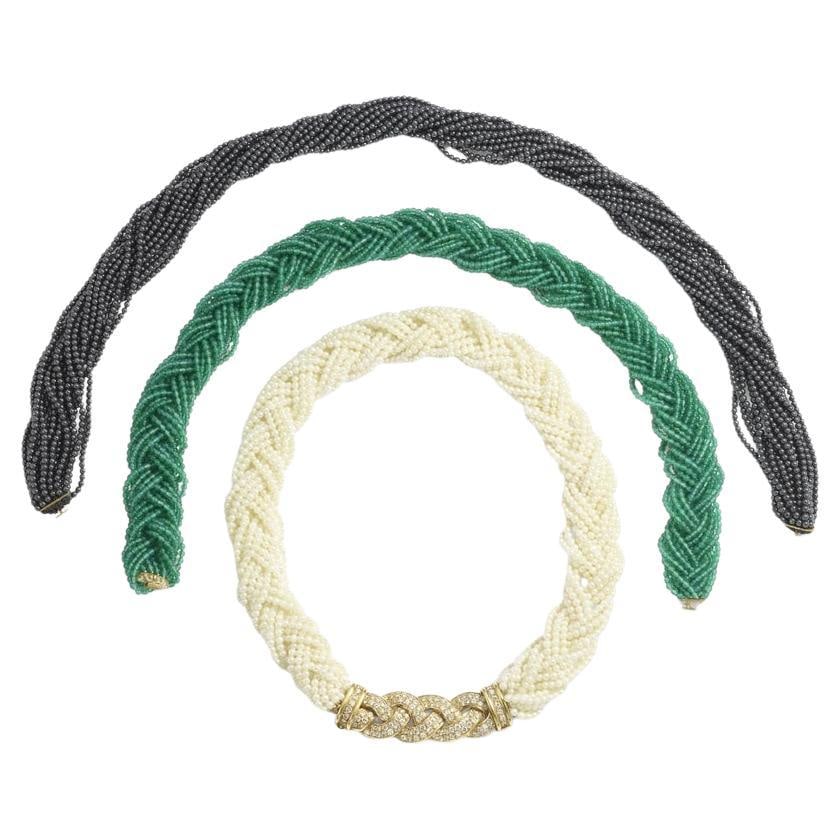Van Cleef & Arpels Set 18k Gold Diamond Interchangeable Gemstone Bead Necklaces: About the Item This vintage Van Cleef & Arpels set features three interchangeable beaded necklaces anchored by an 18k yellow gold and diamond clasp in a braided motif. The clasp, weighing 15.4 grams,
