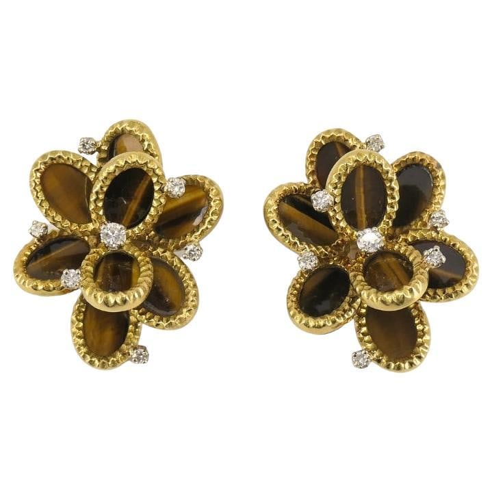 French Tiger's Eye Earrings Diamond 18k Gold Flower Design: About the Item A pair of French tiger's eye earrings, made of 18k gold with tiger’s eye gemstones and diamonds. This vintage pair of French earrings offers a rich, earthy palette and a layered