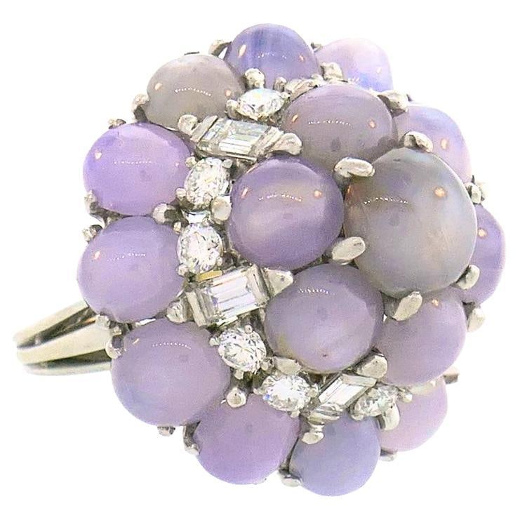Vintage Oscar Heyman Star Sapphire Diamond Cluster Platinum Ring: About the Item An Oscar Heyman star sapphire diamond cluster platinum ring. The ring features a striking combination of star sapphires (total weight is 25.45 carats), round brilliant and baguette cut
