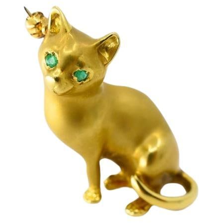 18k Gold Brooch Vintage Cat Pin Gemstones: About the Item This cat brooch has a charming, lifelike quality. The matte gold finish gives the cat a soft appearance, as if it's been captured mid-pose. Its slender body and gracefully curved tail