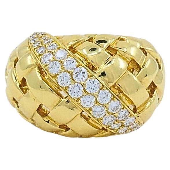 Tiffany and Co. 18K Gold Diamond Dome Vannerie Ring: About the Item DESIGNER: Tiffany & Co. CIRCA: 1990’s MATERIALS: 18k Yellow Gold GEMSTONE: Round Brilliant Cut Diamond WEIGHT: 14.2 Grams MEASUREMENTS: 9/16" Top Width RING SIZE: 5.25 HALLMARKS: