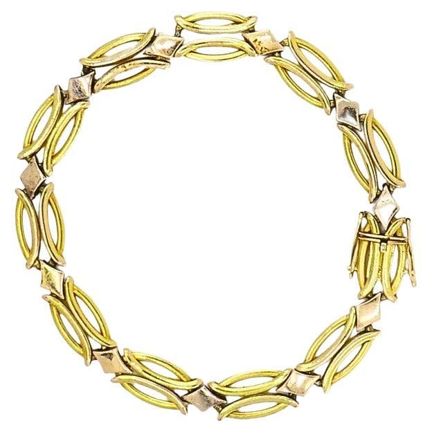 Vintage Two-Tone 14k Gold Link Bracelet: About the Item A vintage two-tone 14k gold link bracelet. The design features alternating open marquise-shaped links in yellow gold and polished diamond shaped connectors in rose gold. The openwork